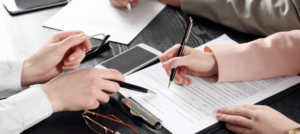 A client signs mesothelioma claims papers in an attorney's office