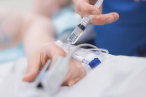 A patient receives a CTLA-4 infusion through an IV