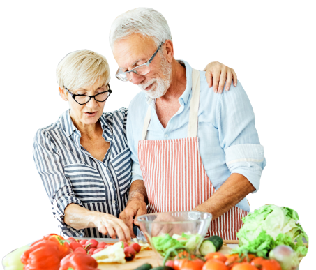 A senior couple making a salad